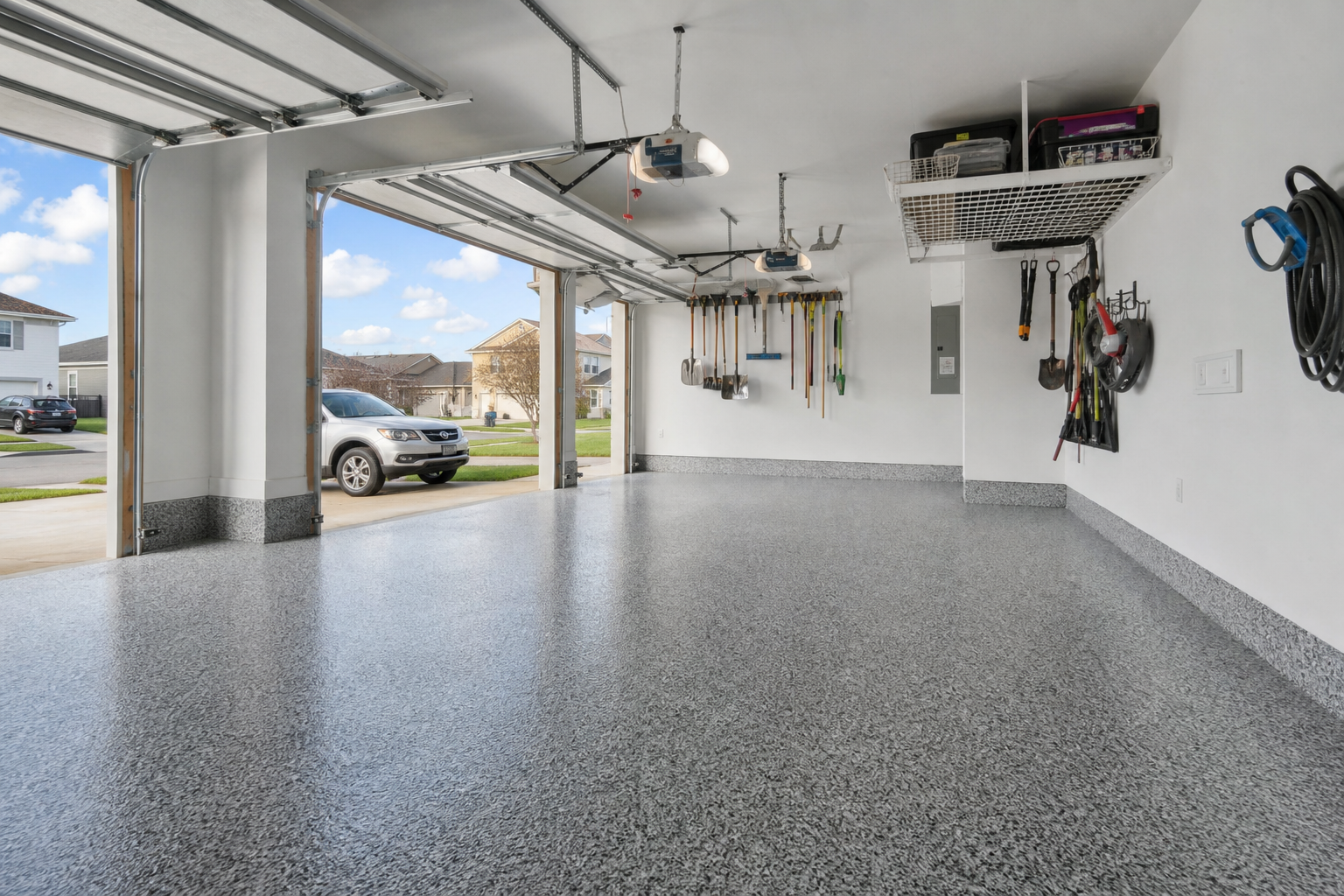 Beautiful glossy concrete garage floor coating by DFW Coatings